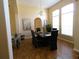 Formal dining room with large windows, hardwood floors, and modern chandelier at 742 Chamberlin Trl, St Cloud, FL 34772