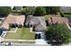 Beautifully maintained home with a 2-car garage, manicured lawn, and two cars parked in the driveway at 742 Chamberlin Trl, St Cloud, FL 34772
