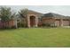 Charming single-story home with well-manicured lawn and tasteful landscaping at 742 Chamberlin Trl, St Cloud, FL 34772