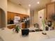Functional kitchen with wooden cabinets, stainless steel appliances, and a breakfast bar at 742 Chamberlin Trl, St Cloud, FL 34772