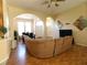 Bright and airy living room with archways, hardwood floors, and neutral paint at 742 Chamberlin Trl, St Cloud, FL 34772