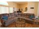 Spacious living room featuring hardwood floors and a comfortable oversized couch at 742 Chamberlin Trl, St Cloud, FL 34772
