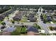 Aerial view of a tranquil suburban neighborhood featuring well-maintained homes and tree-lined streets at 742 Chamberlin Trl, St Cloud, FL 34772