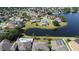 Panoramic aerial view showcasing homes nestled around a serene lake in a picturesque community at 742 Chamberlin Trl, St Cloud, FL 34772