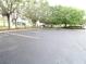 This parking lot provides convenient parking, surrounded by mature trees, for easy access to community amenities at 742 Chamberlin Trl, St Cloud, FL 34772