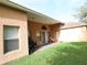 Spacious covered patio area perfect for outdoor living, with ample space for seating and dining at 742 Chamberlin Trl, St Cloud, FL 34772