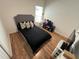 Bedroom with a comfortable bed, laminate flooring, and natural light from the window at 939 Anna Pl, Davenport, FL 33837