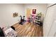 View of a bedroom featuring light walls, wood flooring, and a large closet at 939 Anna Pl, Davenport, FL 33837