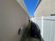 Home exterior with a fenced yard and outdoor spigot at 939 Anna Pl, Davenport, FL 33837