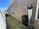 Home exterior featuring a water filtration system and manicured lawn at 939 Anna Pl, Davenport, FL 33837