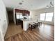 Bright kitchen featuring a center island with seating, stainless steel appliances, and modern lighting at 939 Anna Pl, Davenport, FL 33837