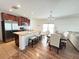 Spacious open concept kitchen with stainless steel appliances, granite counters, and adjacent dining area at 939 Anna Pl, Davenport, FL 33837