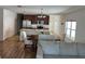Open concept living space featuring eat in kitchen with modern cabinets and seating with bright windows at 939 Anna Pl, Davenport, FL 33837