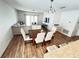 Bright open-concept living space connecting the dining area and living room with modern furniture and decor at 939 Anna Pl, Davenport, FL 33837