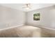 Bedroom featuring wood-look floors, neutral walls, and a bright window with natural light at 9513 Bahia Rd, Ocala, FL 34472