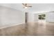 Spacious living room with light wood flooring and modern ceiling fan at 9513 Bahia Rd, Ocala, FL 34472