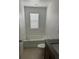 Bright bathroom showcasing a soaking tub, toilet, and a vanity with a granite countertop at 11713 Tidal Alley Trl, Orlando, FL 32832