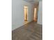 Carpeted bedroom featuring tile leading to the ensuite bathroom with a glass-enclosed shower at 11713 Tidal Alley Trl, Orlando, FL 32832
