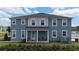 Inviting home exterior showcasing a cozy front porch and tidy landscaping at 11713 Tidal Alley Trl, Orlando, FL 32832