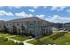 Beautiful townhome exterior featuring manicured landscaping and charming curb appeal at 11713 Tidal Alley Trl, Orlando, FL 32832
