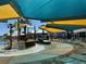 Splash pad and pool with colorful shade canopies at 11713 Tidal Alley Trl, Orlando, FL 32832