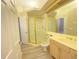 Bright bathroom with a gold-trimmed shower and vanity with attractive fixtures at 14313 Dulcimer Ct, Orlando, FL 32837