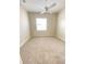 Cozy bedroom featuring neutral carpet, a ceiling fan, and a bright window at 14313 Dulcimer Ct, Orlando, FL 32837