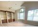 Elegant living area boasting stylish built-in shelving, modern flooring, and lots of natural light at 14313 Dulcimer Ct, Orlando, FL 32837