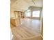Bright and open living area with modern flooring, built-in shelves, and plenty of natural light at 14313 Dulcimer Ct, Orlando, FL 32837