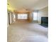 Spacious living room with a ceiling fan, neutral paint, and a fireplace at 14313 Dulcimer Ct, Orlando, FL 32837