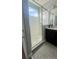 Modern bathroom featuring a glass-enclosed shower, sleek vanity, and clean, contemporary design at 236 Villa Domani Cir, Davenport, FL 33896