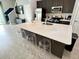 Spacious kitchen with a large island featuring bar seating and sleek countertops at 236 Villa Domani Cir, Davenport, FL 33896