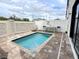 Backyard with a pool, paver patio, modern fence, and outdoor seating for relaxation and entertaining at 236 Villa Domani Cir, Davenport, FL 33896