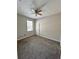 Bedroom with carpeting, fan, and large window at 3351 Whitestone Cir # 101, Kissimmee, FL 34741