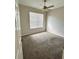 Cozy bedroom with carpeting, fan, and window for natural light at 3351 Whitestone Cir # 101, Kissimmee, FL 34741