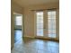 Bright dining area with tile floor and double doors to exterior at 3351 Whitestone Cir # 101, Kissimmee, FL 34741