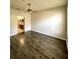 Spacious main bedroom boasts wood-look flooring and attached bathroom at 3351 Whitestone Cir # 101, Kissimmee, FL 34741