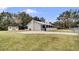 Charming single-story home with a metal roof, fenced yard, shed, and a long driveway at 616 Se 31St Ter, Ocala, FL 34471