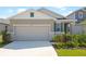 Charming single-story home with a two-car garage, well-manicured lawn, and tasteful landscaping at 6389 Clover St, Lake Hamilton, FL 33851