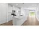 Beautiful kitchen with an island, stainless steel appliances and plenty of natural light at 6389 Clover St, Lake Hamilton, FL 33851