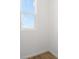 Corner view of a room with wood flooring and a bright window view at 6389 Clover St, Lake Hamilton, FL 33851