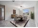 Elegant dining room featuring a modern chandelier and a wooden table set for a cozy meal at 1848 Ancestry Trl, Kissimmee, FL 34746