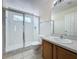 Bathroom featuring walk-in shower, toilet, and vanity with sink at 205 Minniehaha Cir, Haines City, FL 33844