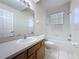 Bathroom featuring a bathtub and vanity with a light wood cabinet at 205 Minniehaha Cir, Haines City, FL 33844
