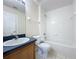 Bathroom with a single vanity, bath tub and tile flooring at 205 Minniehaha Cir, Haines City, FL 33844