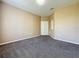 Spacious carpeted room with an alcove and white trim at 205 Minniehaha Cir, Haines City, FL 33844