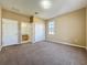 View of bedroom with carpet, closet and adjacent bathroom at 205 Minniehaha Cir, Haines City, FL 33844