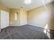 Empty room featuring carpet and an alcove at 205 Minniehaha Cir, Haines City, FL 33844