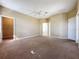 Spacious carpeted bedroom with multiple doors and large closet at 205 Minniehaha Cir, Haines City, FL 33844