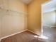 Walk-in closet with hanging racks and carpeted floor at 205 Minniehaha Cir, Haines City, FL 33844